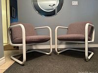 Both matching cantilever chairs angled front view