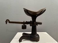 Full view of crowfoot balance scale side profile