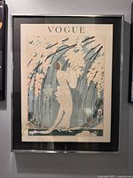 Full view of framed Vogue cover lithograph on wall