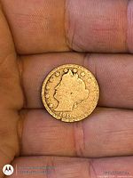 Obverse view of 1911 Liberty Head nickel in hand