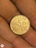 Reverse side with large 5, maple leaves, date 1933