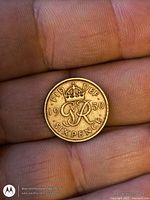 Reverse side of 1950 sixpence coin showing crowned GR monogram and date