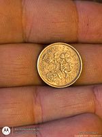 Reverse of 1967 sixpence coin showing floral emblems and date