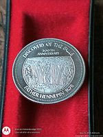 Obverse showing waterfall scene and anniversary text