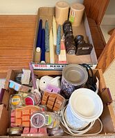 Overall view of both boxes with wax melts, warmers and candles