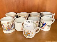 Group shot of nine royal commemorative mugs