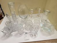 Group shot of all crystal and glass pieces on table