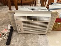 Front view of Danby window air conditioner showing grille and controls