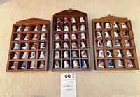 Three wood cases filled with thimbles, full lot view