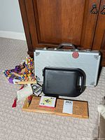 Overall lot showing poker case, cribbage board, Mastermind board, black case