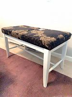 Full view of Canadel bench showing white frame and upholstered cushion