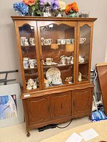 Front view of Knechtel china cabinet showing upper glass display and lower storage