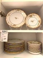 Cabinet view showing dinner and salad plates in matching pattern