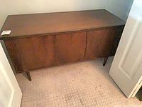 Front view of wooden cedar chest showing overall design