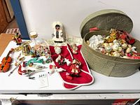 Group view of all ornaments, stocking, hat box