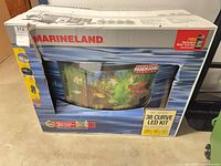 Front of boxed Marineland 38 Curve LED Kit showing curved aquarium image