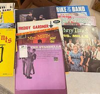 Stack of records showing multiple album covers