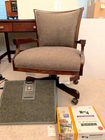 Front view of chair, footrest and boxed TV mount