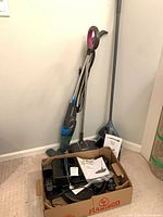 All four cleaning devices with Roomba parts in box