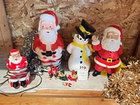 Group shot showing plug-in Santa, three 1978 ceramic figures, elf figures and tinsel garlands