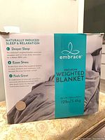 Front of box showing Embrace branding and product details