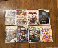 All eight Wii game cases front view