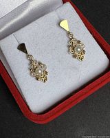 Pair of gold filigree pearl earrings in box