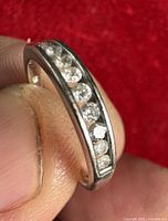 Ring side view showing channel-set diamonds