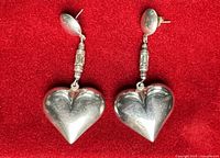Front view of both sterling silver heart earrings
