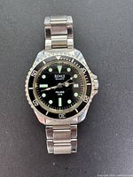 Front view showing dial, bezel, and brand