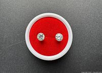 Front view of both sterling stud earrings in case