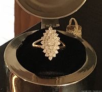 Front view of 10K gold marquise cluster ring with CZ stones