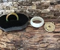 both jade rings and coin pendant front view