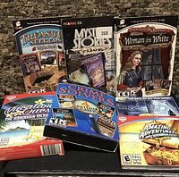 Front view of all seven boxed PC games