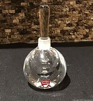 Front view of Orrefors Sweden crystal perfume bottle with stopper inserted