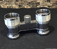 Front view of Rinolux chrome and mother-of-pearl opera glasses