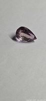 Pear-cut ametrine side profile showing luster