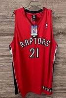 Front view of Adidas Toronto Raptors Nathan Jawai #21 jersey with hangtag