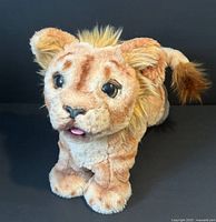 Front view of Simba interactive plush
