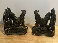 Both cast iron rooster bookends front view
