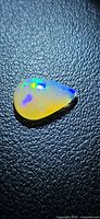Front view of pear-shaped opal showing play-of-color