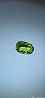 Front view of rectangular cushion-cut apple green peridot