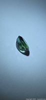 Side profile of the oval green tourmaline