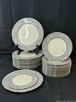 Stacked dinner and salad plates showing quantity and pattern