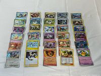 All cards laid out in three columns on white surface