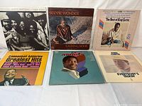 All six record jackets laid out front view