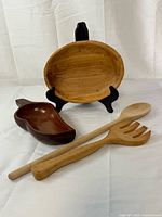 All four wooden serving items displayed