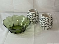 Overall lot showing green glass bowl and two white/green ceramic mugs