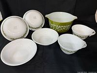 Full set arranged; shows mixing bowl, four bowls, two cups
