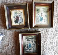 Three framed Victorian prints grouped on wall